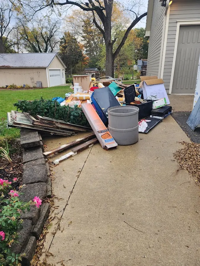 Dumpster being loaded with debris for Roofing Dumpster Rental in Ontario